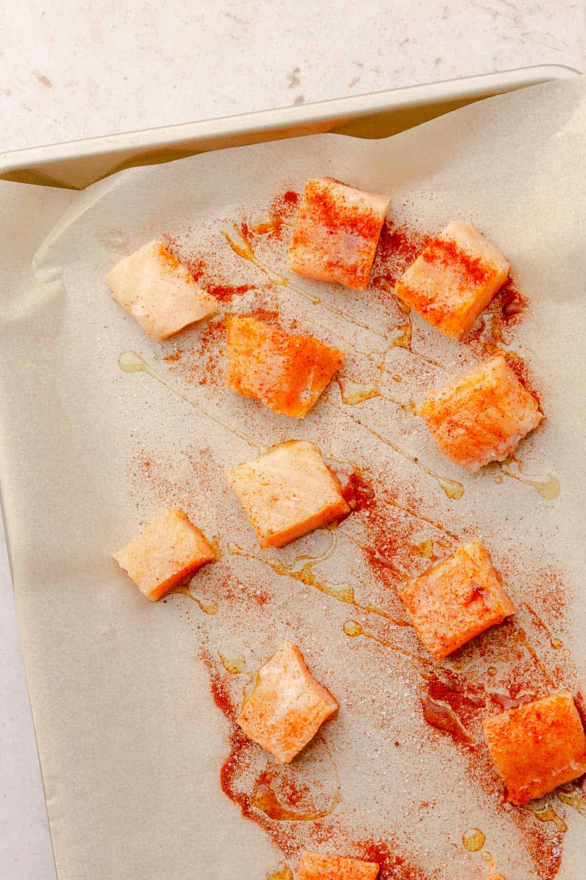 roasted salmon bites on a baking sheet.