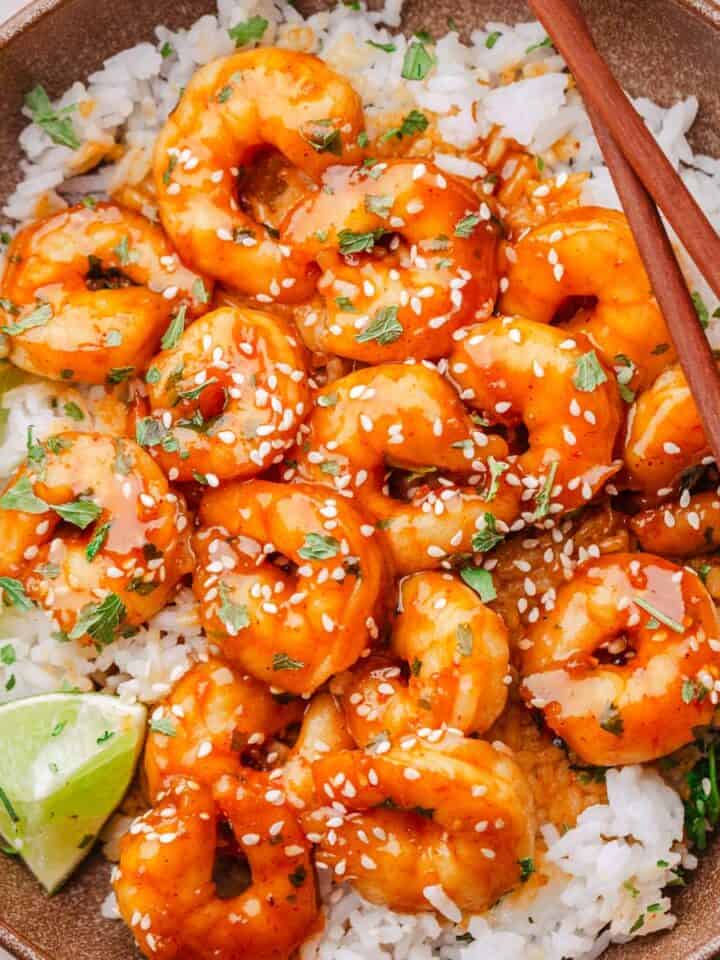 hot honey spicy shrimp with rice and lime.