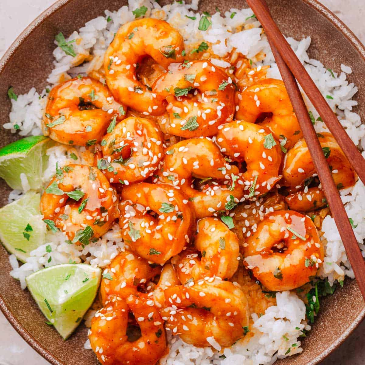 hot honey spicy shrimp with rice and lime.