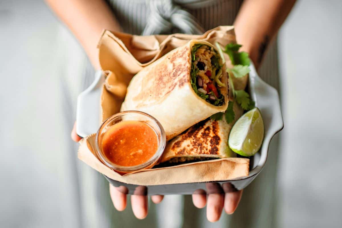 Tasty tortilla served with sauce on the side.