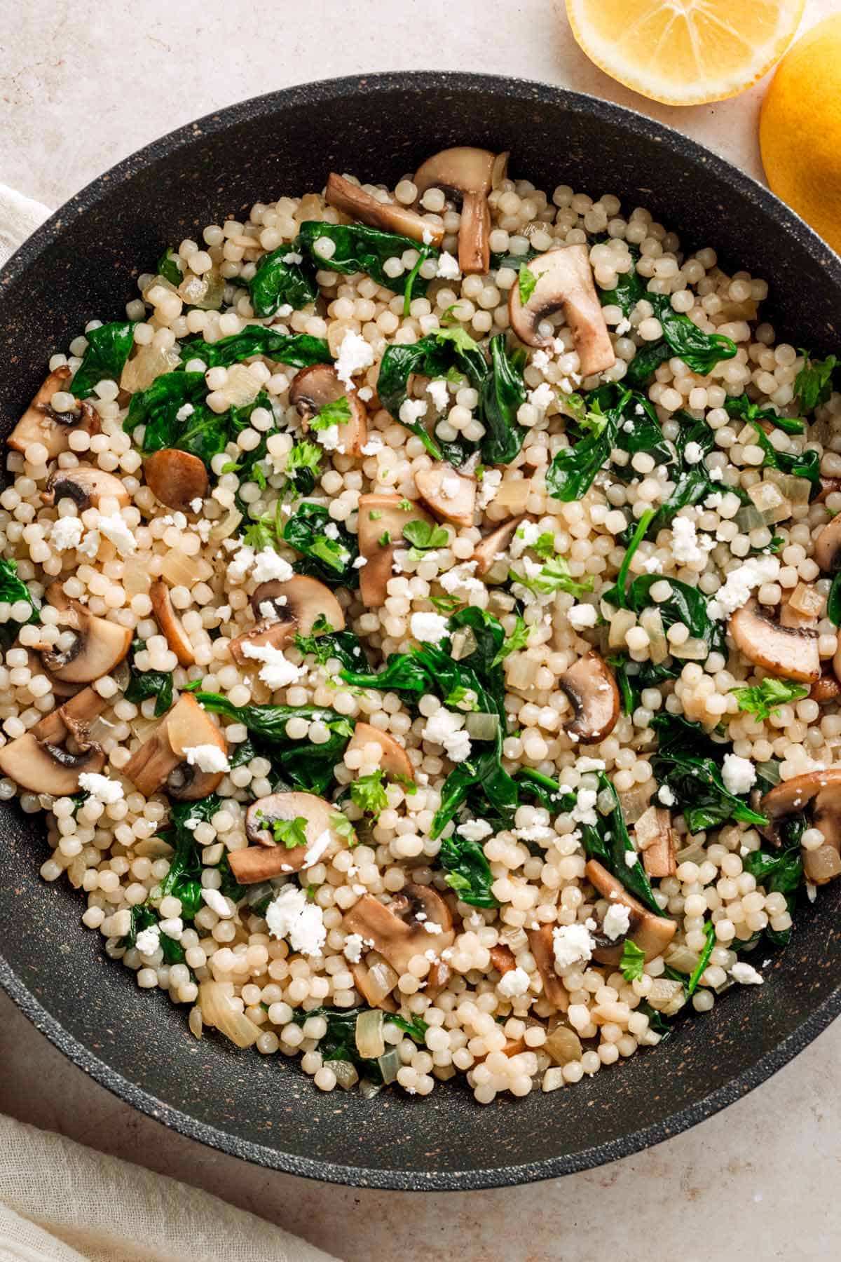 Israeli Couscous recipe with mushrooms and spinach.