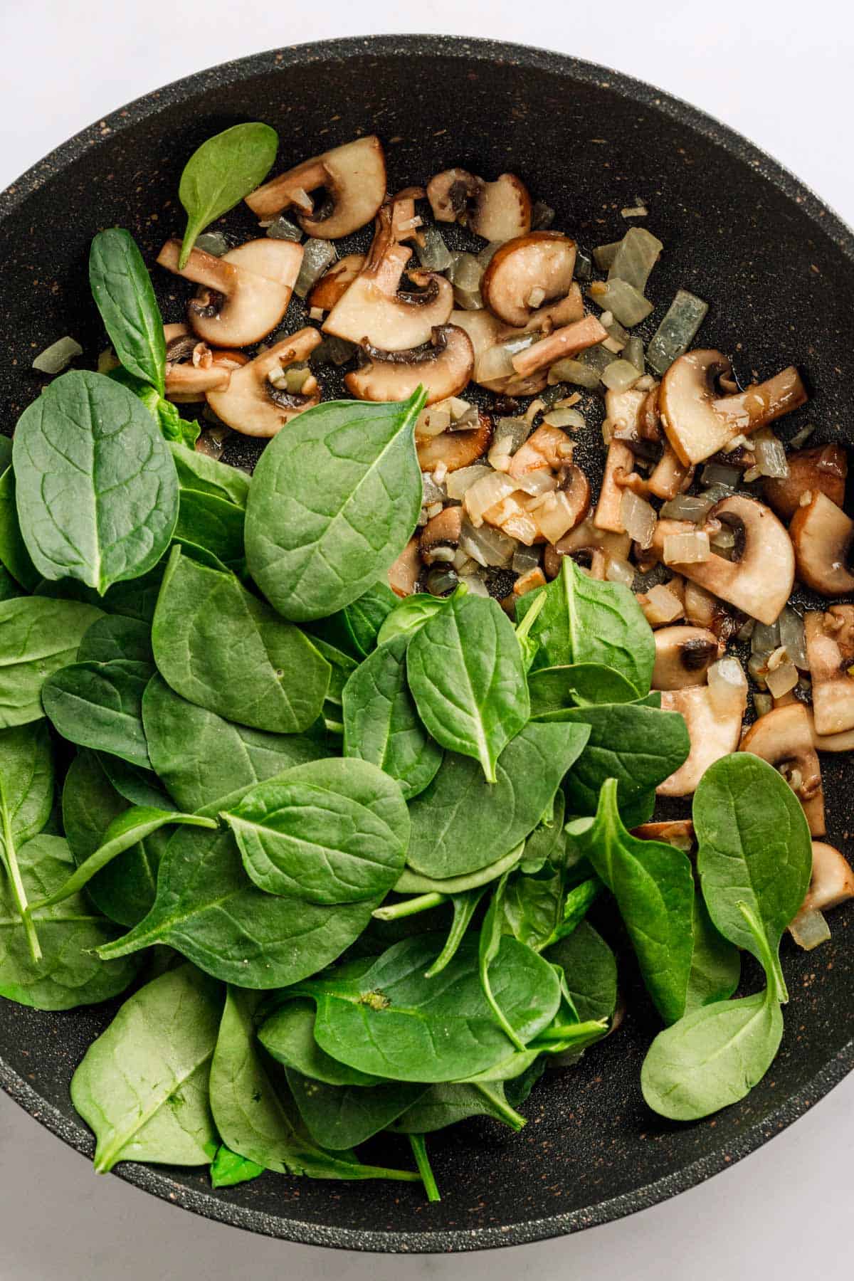 Couscous recipe with mushrooms and spinach.