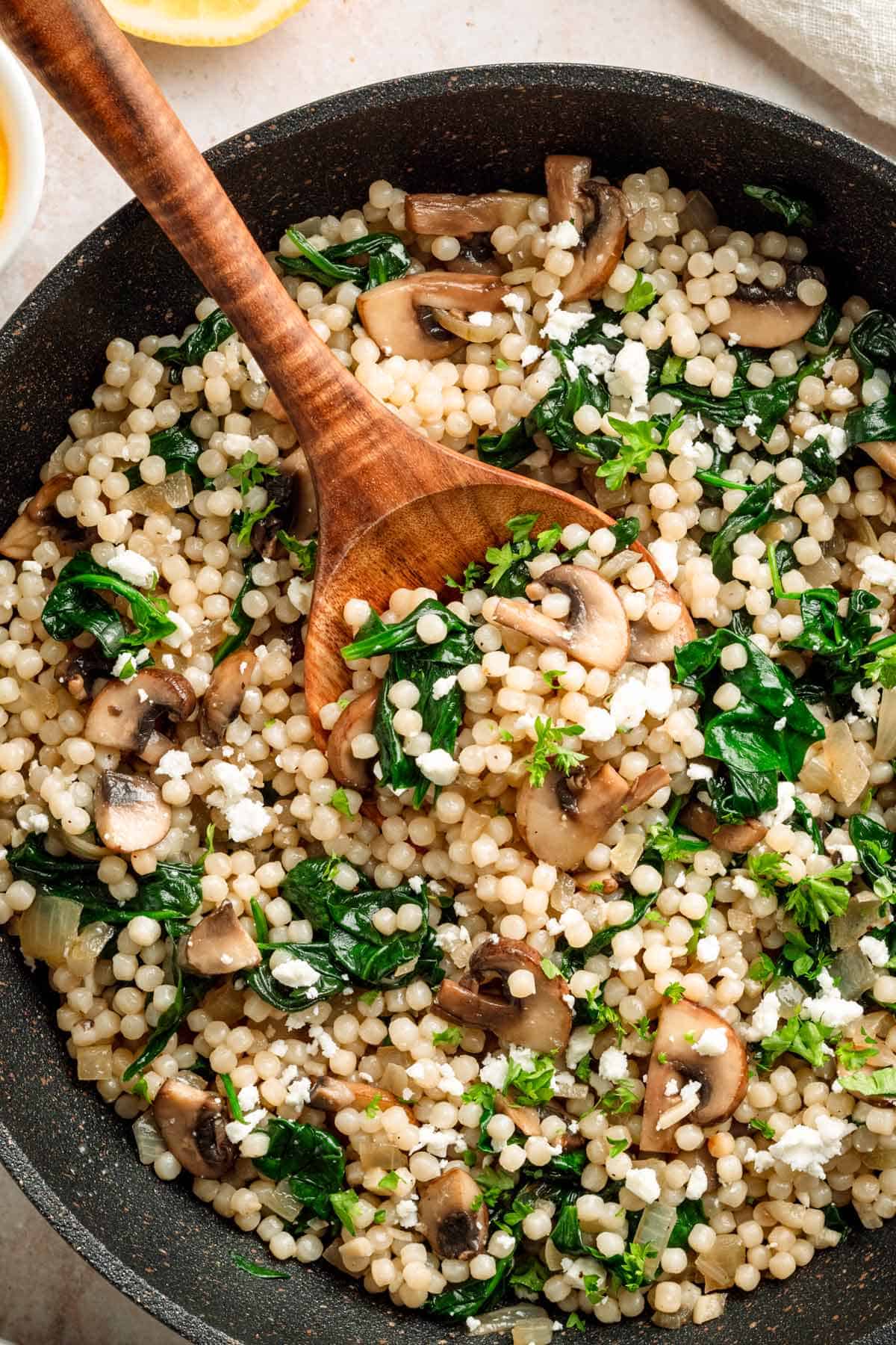 Israeli Couscous recipe with mushrooms and spinach.