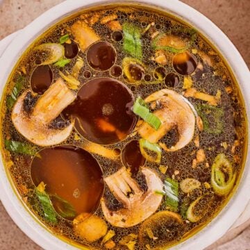 Easy Japanese clear soup made with mushrooms, carrots, green onions, garlic, and sesame oil.