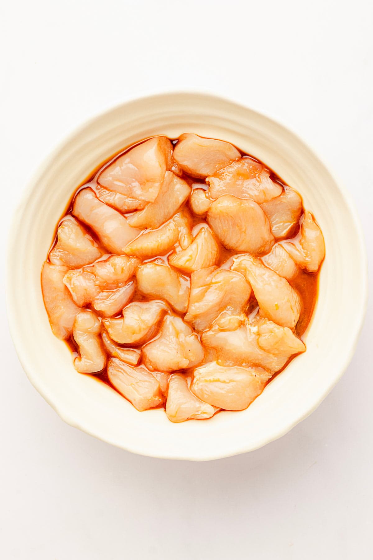 marinated chicken in a bowl.