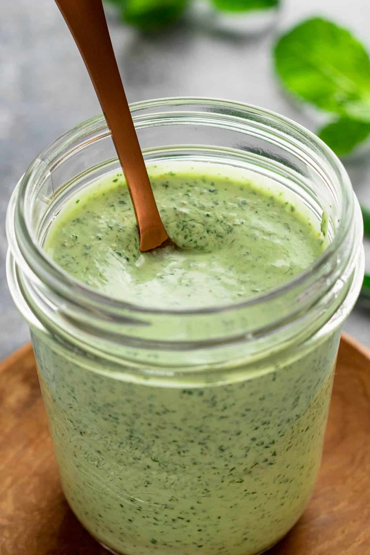 green herby dressing in a jar