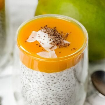 mango chia pudding with mango pulp and shredded coconut.