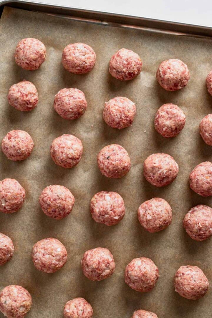 meatballs on baking sheet ready for baking.