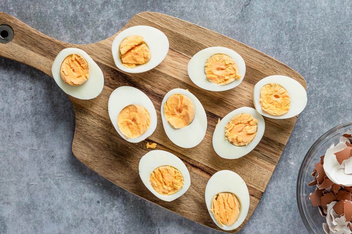 cookes eggs on wooden board