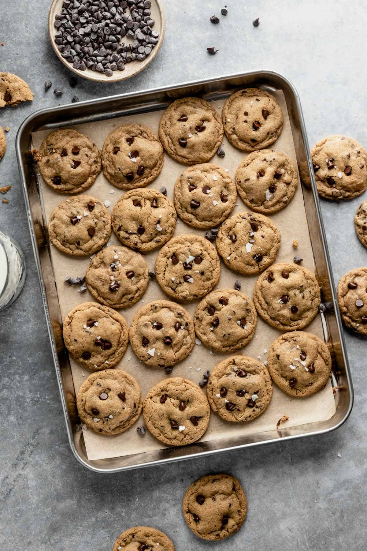 mini chocolate chip cookies on a baking sheet