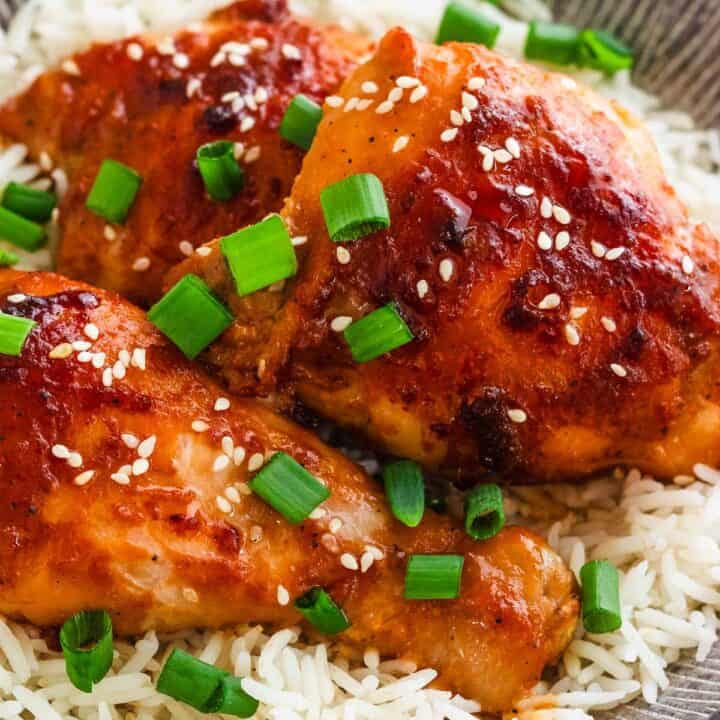 Honey miso chicken thighs served over rice with green onions.