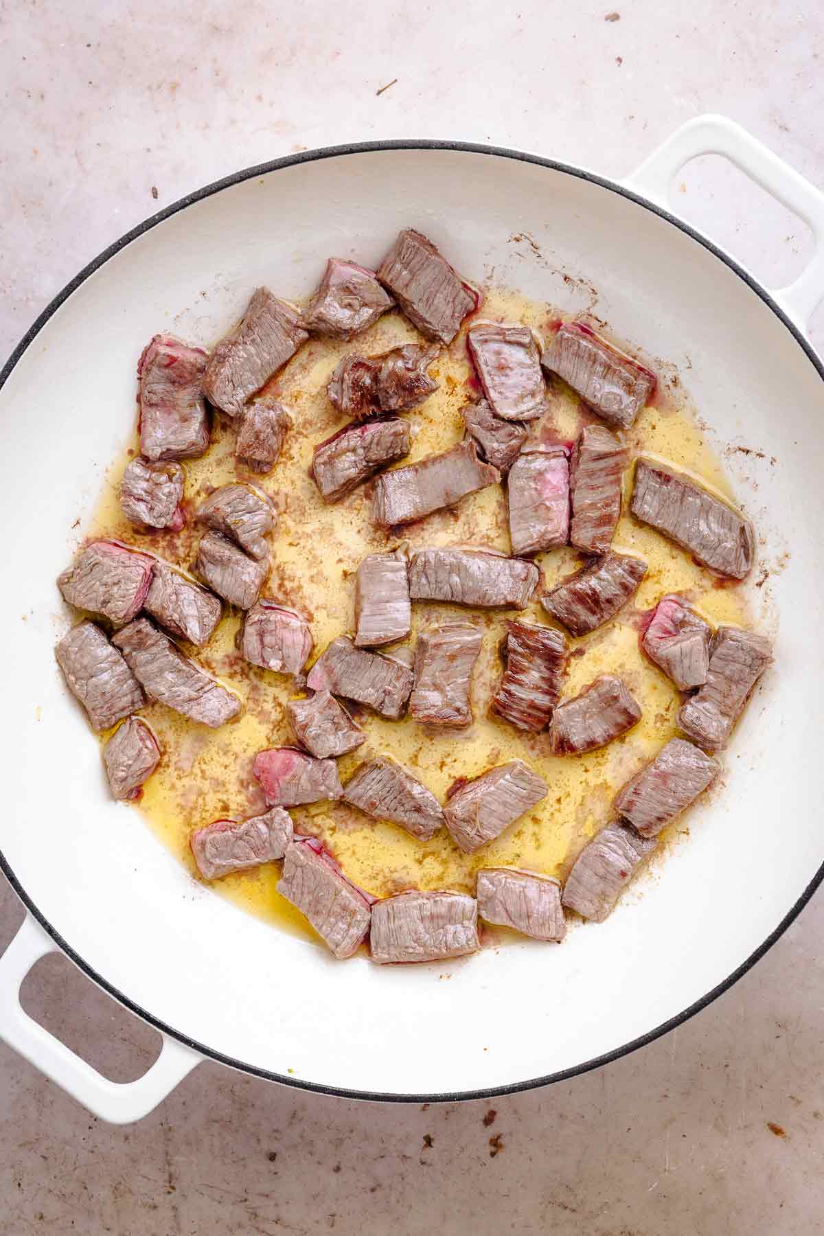 steak in skillet.