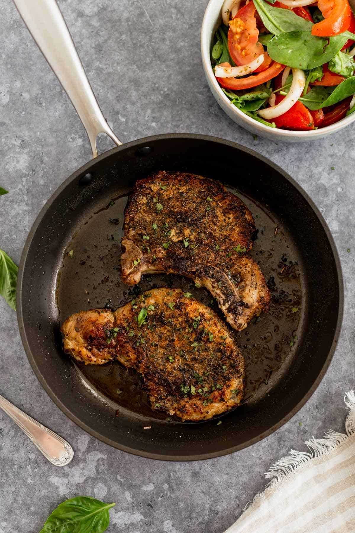 Pan Seared Pork Chops in a pan after cooking