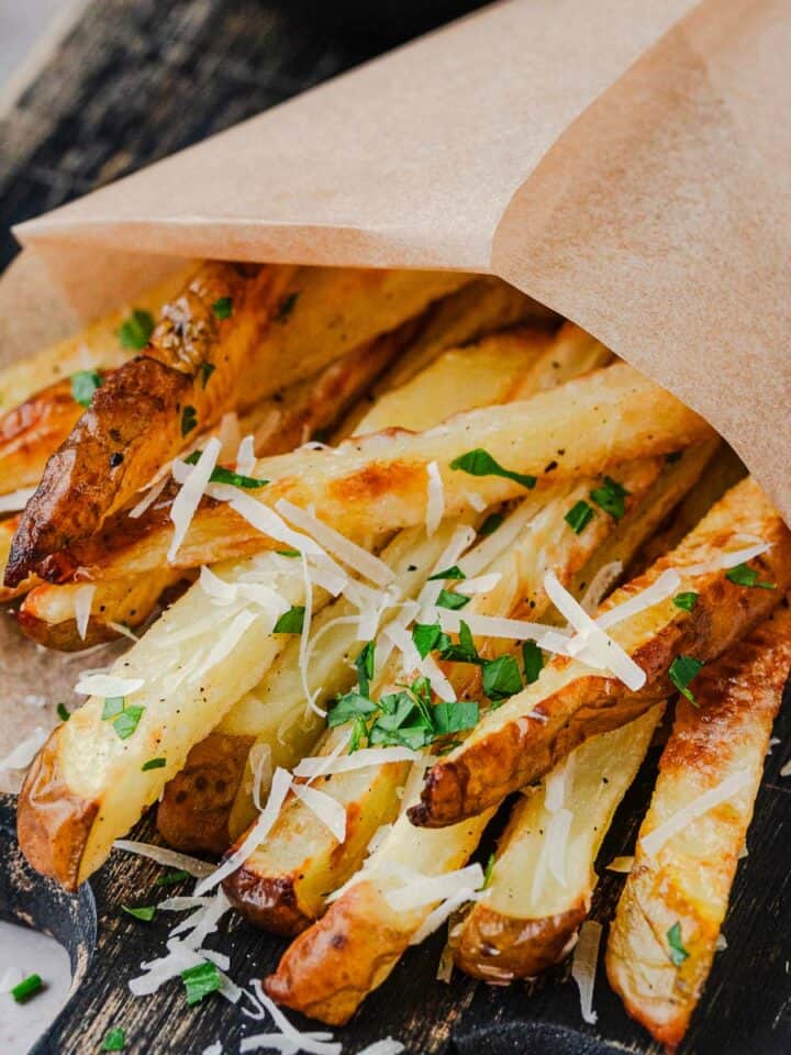 This recipe for Homemade Parmesan Truffle Fries is so good, no frying, easy and quick! Paired with delicious sweet paprika dipping sauce makes it a beautiful lazy evening dinner meal. The Yummy Bowl
