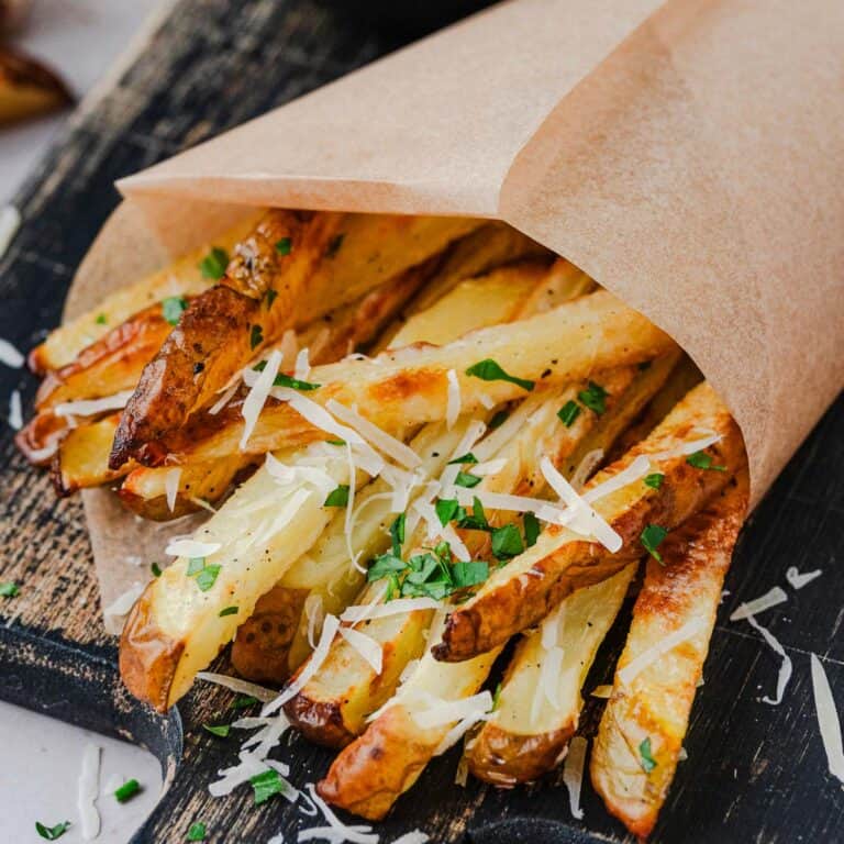 This recipe for Homemade Parmesan Truffle Fries is so good, no frying, easy and quick! Paired with delicious sweet paprika dipping sauce makes it a beautiful lazy evening dinner meal. The Yummy Bowl