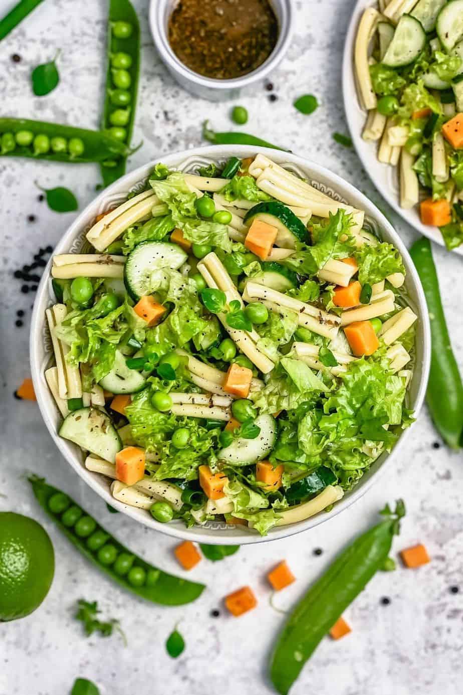 This Pasta Salad Recipe With Cheddar Cheese Cubes is easy to make ahead and is loaded with all the yummy things like peas, lettuce, spring onions, cucumber, and my favorite cheddar cheese. - The Yummy Bowl