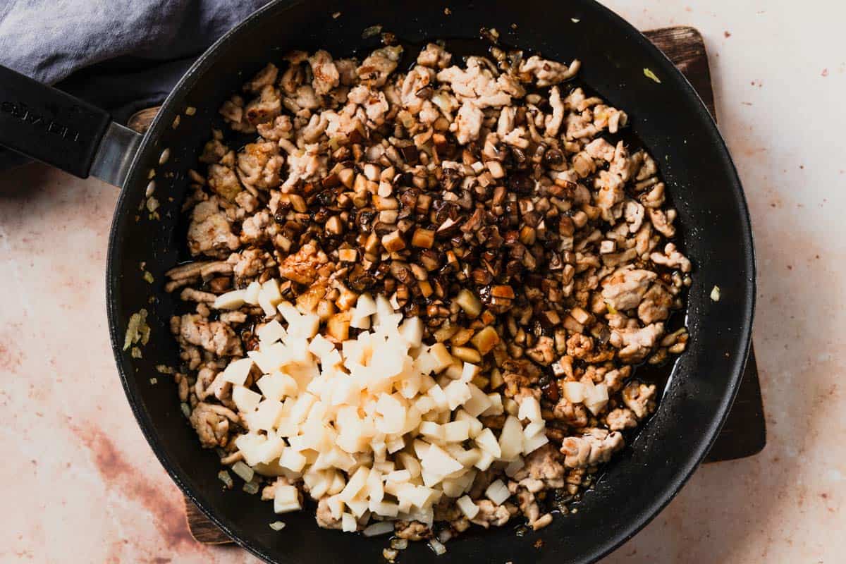 picture of filling for chicken lettuce wraps cooking in a pan