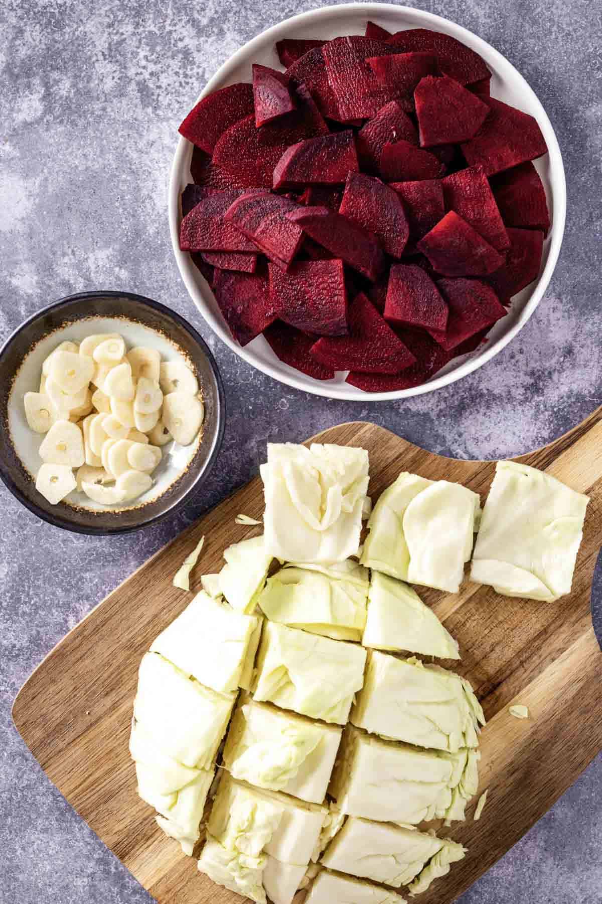 sliced garlic, sliced beets and cabbage.