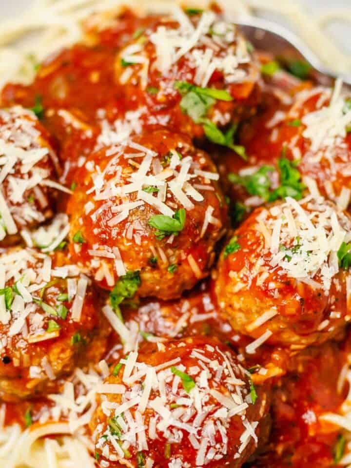 oven baked pork and beef meatballs with marinara sauce.