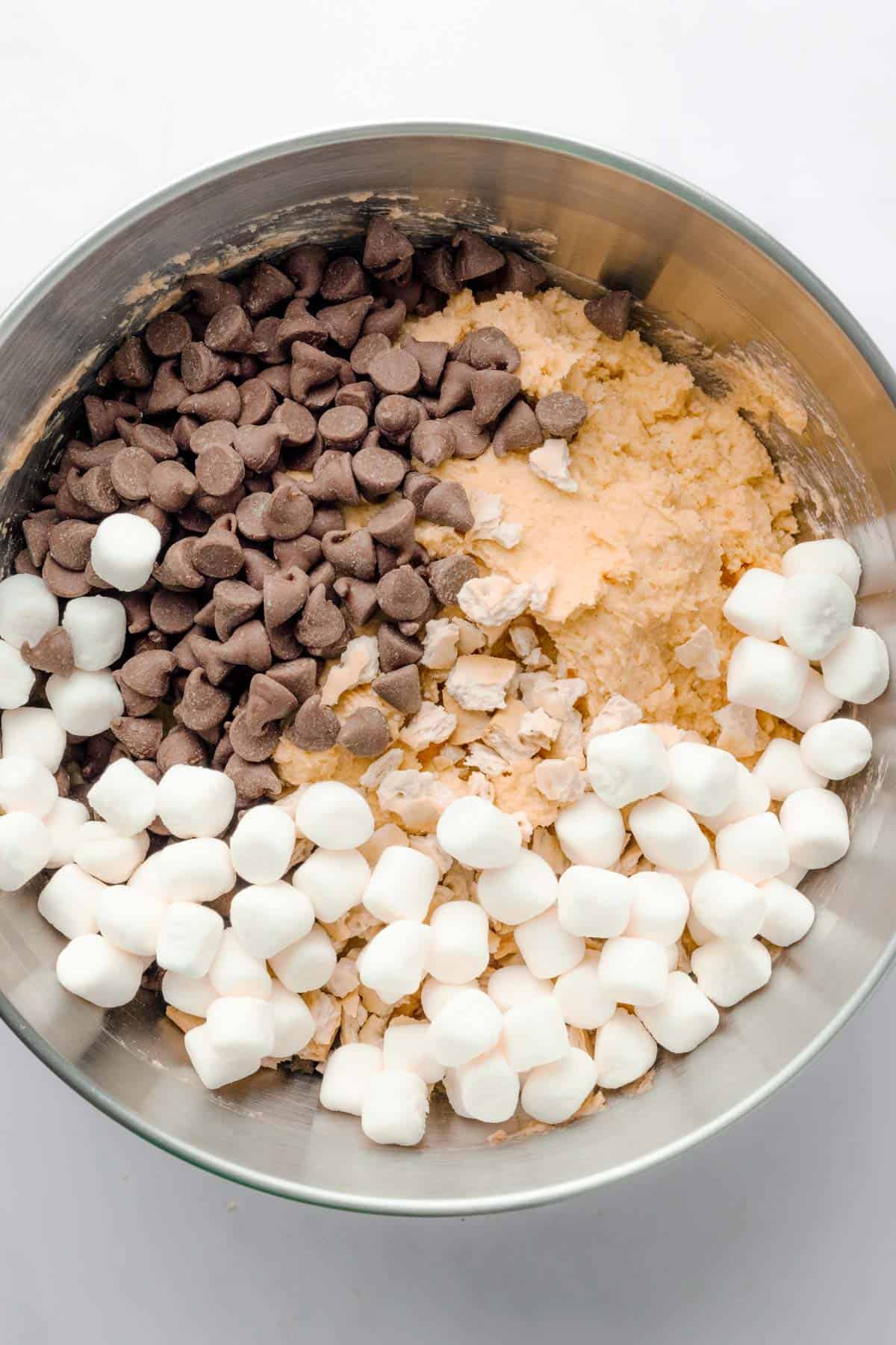 pumpkin cookie batter with chocolate chips and marshmallows.