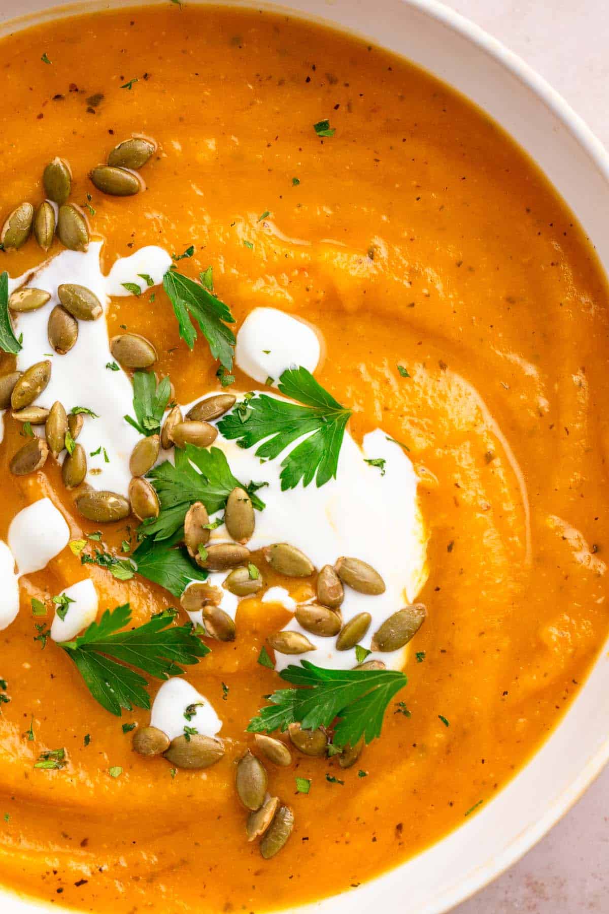 sweet potato pumpkin soup with toppings.