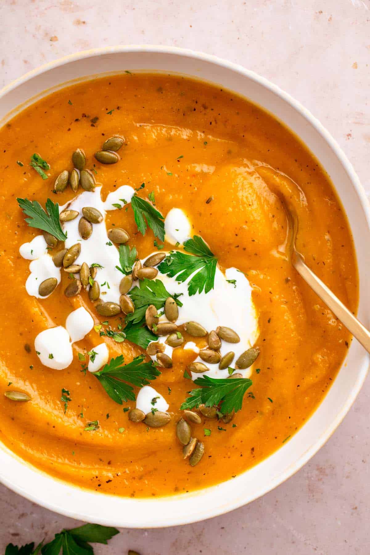 sweet potato pumpkin soup with toppings.
