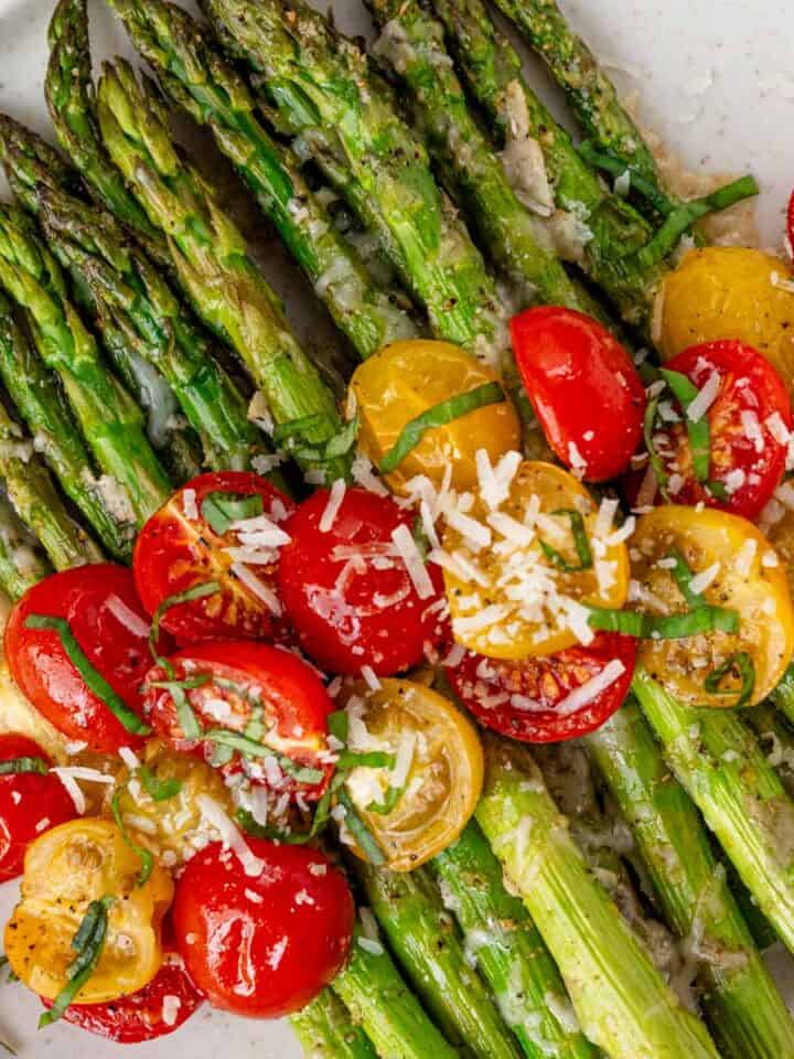 roasted asparagus with cheese and tomatoes.