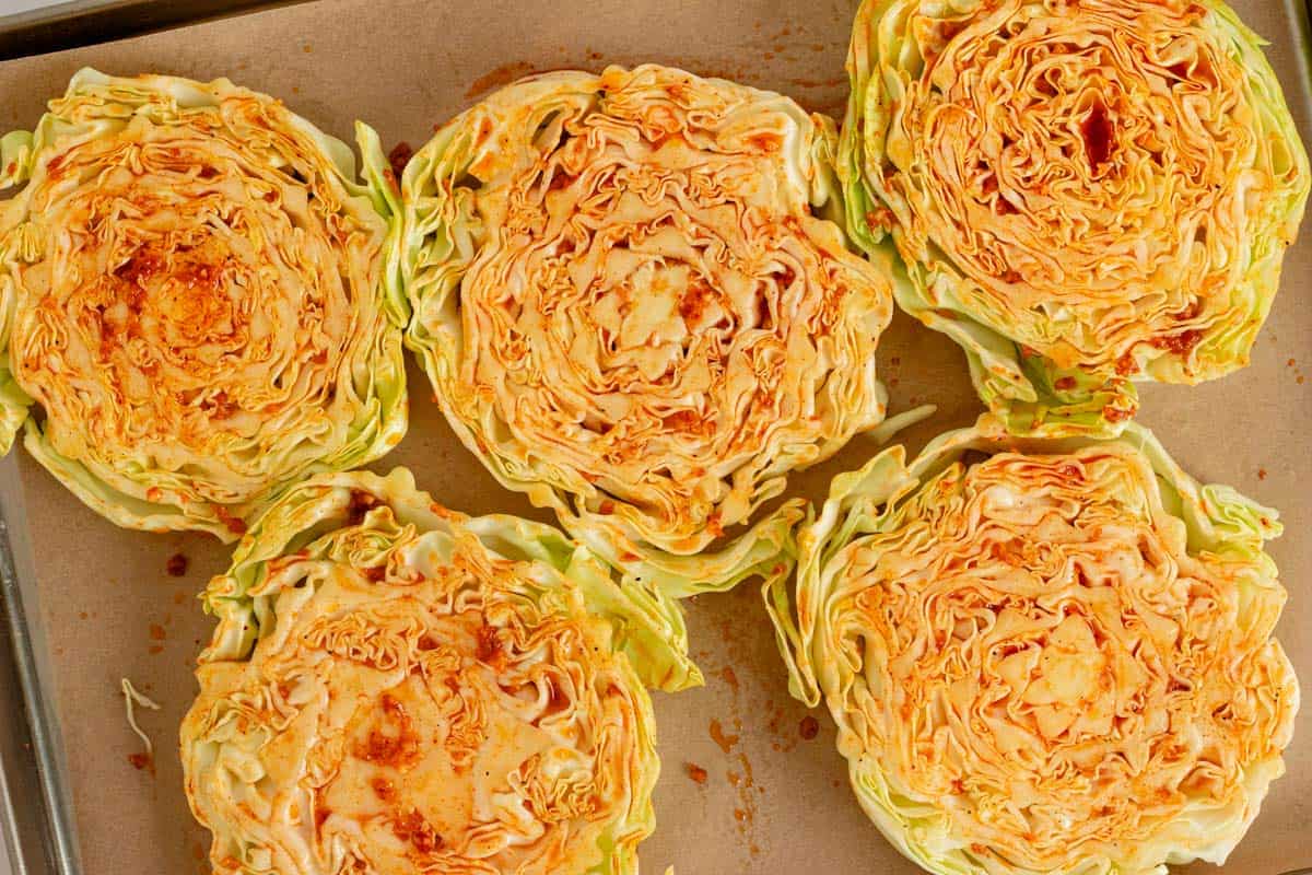 seasoned raw cabbage slices ready for baking