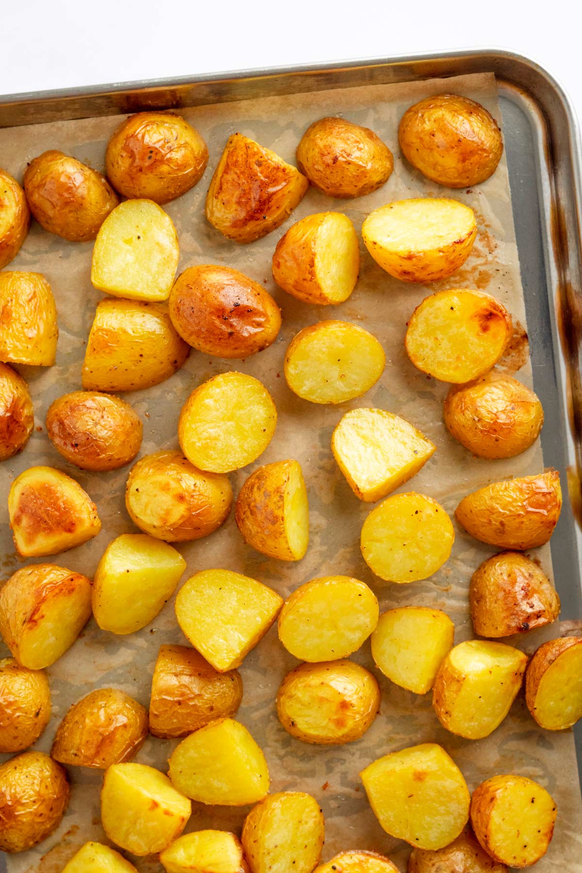 Roasted oven potatoes on a sheet pan.