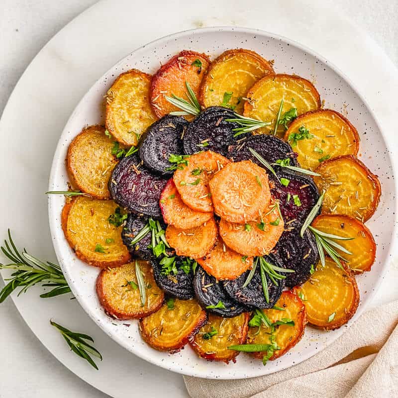 Perfect Rosemary Roasted Beets and Carrots! Easy and quick veggie blend of purple and golden beets, carrots seasoned with rosemary and delicious spices. It’s an excellent go-to side dish that pairs with almost any main course.