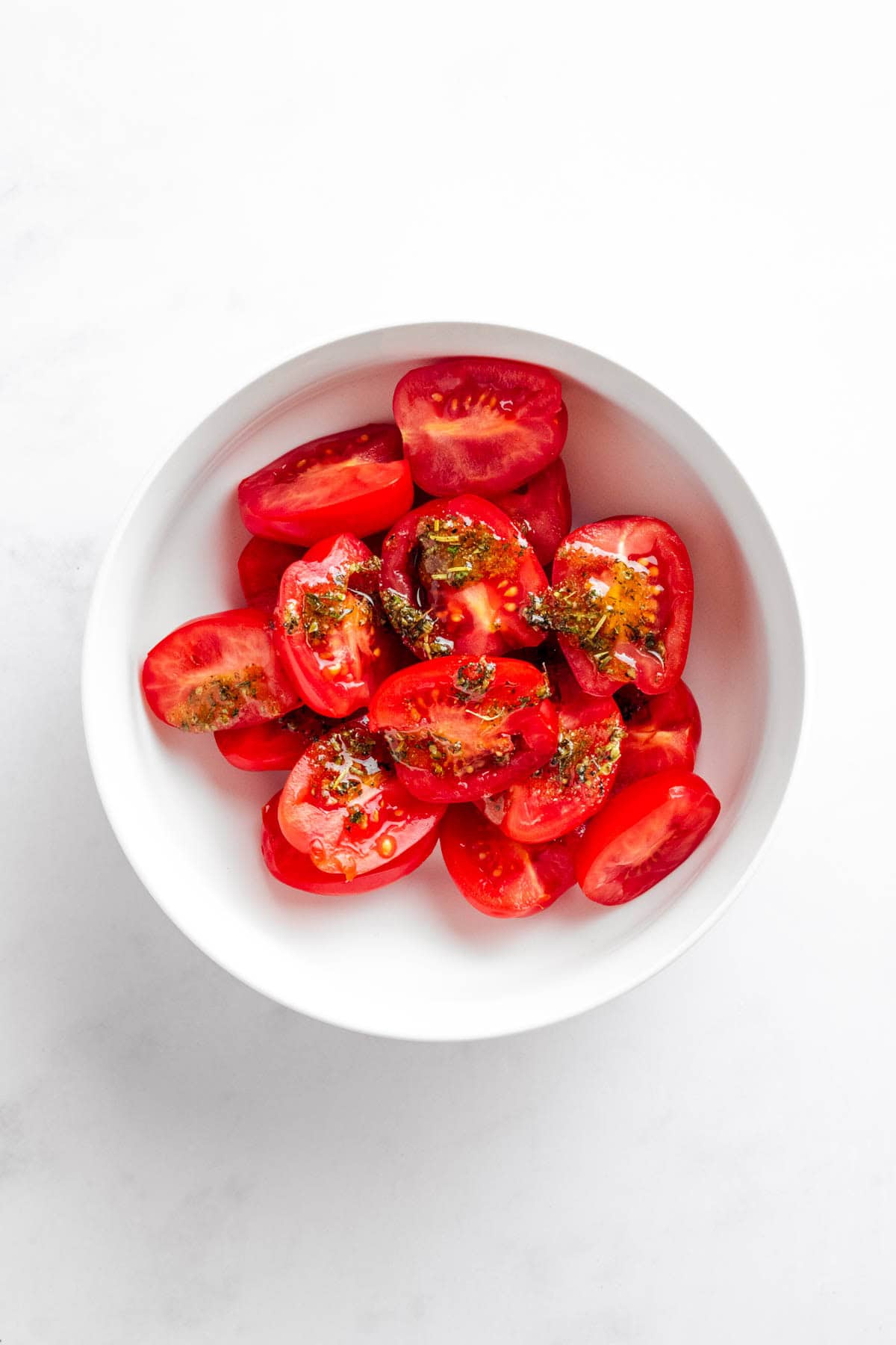sliced tomatoes with herbs.