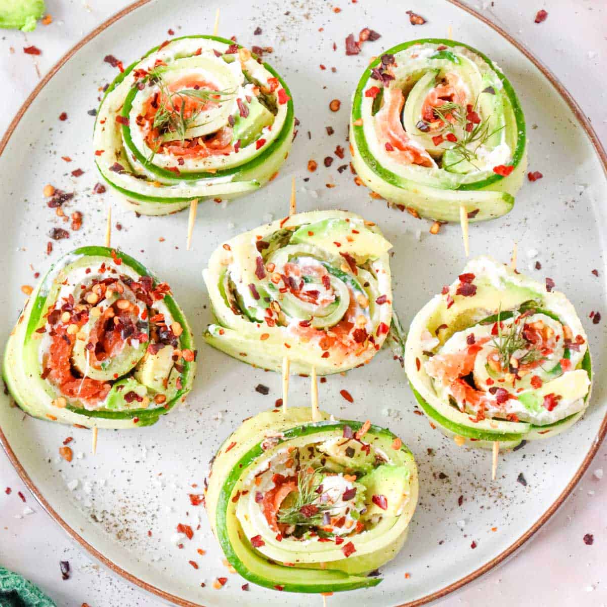 salmon cucumber rolls with sesame seeds.
