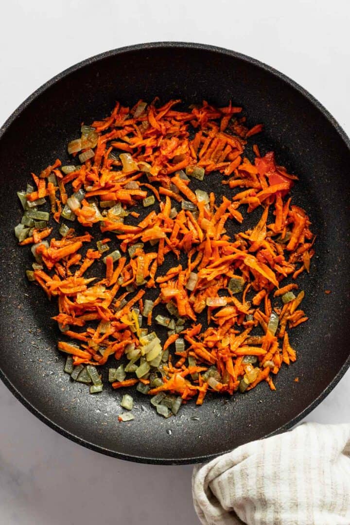 sauteing carrot in skillet.