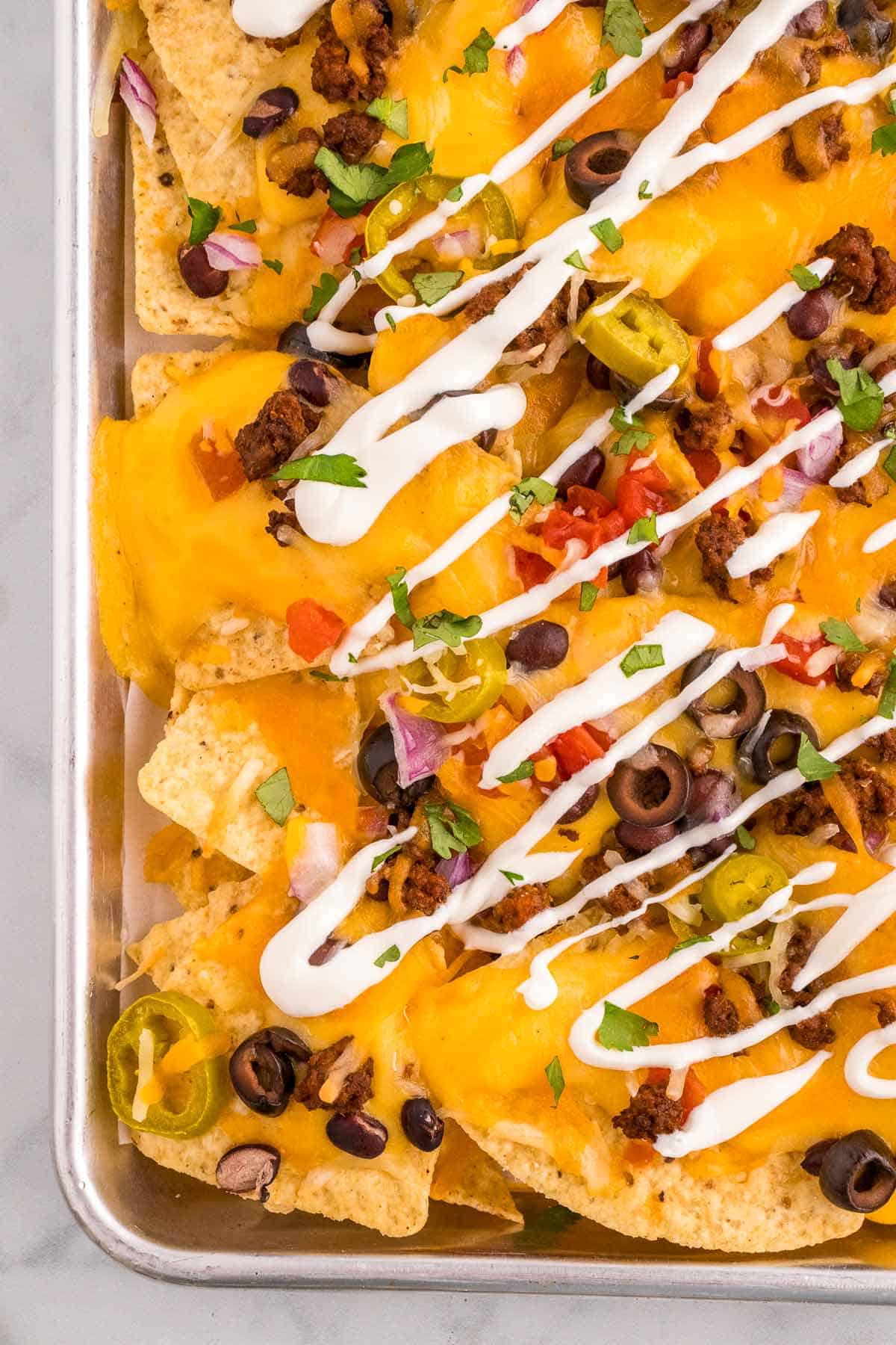 loaded taco meat sheet pan nachos.