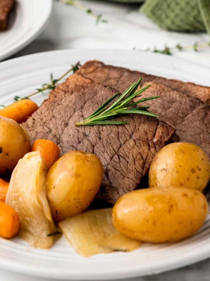 slow cooker rump roast with vegetables on a plate