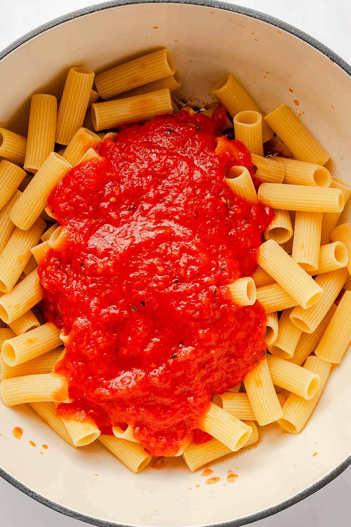 pasta with marinara sauce on top.