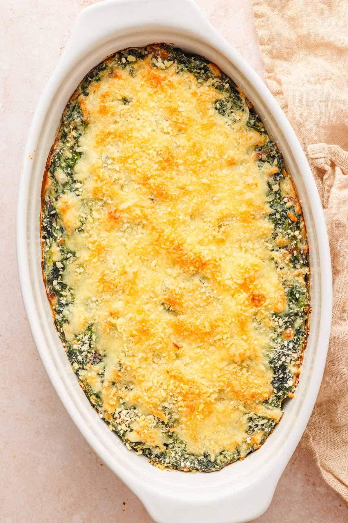 Freshly baked Spinach Gratin with cheesy topping.