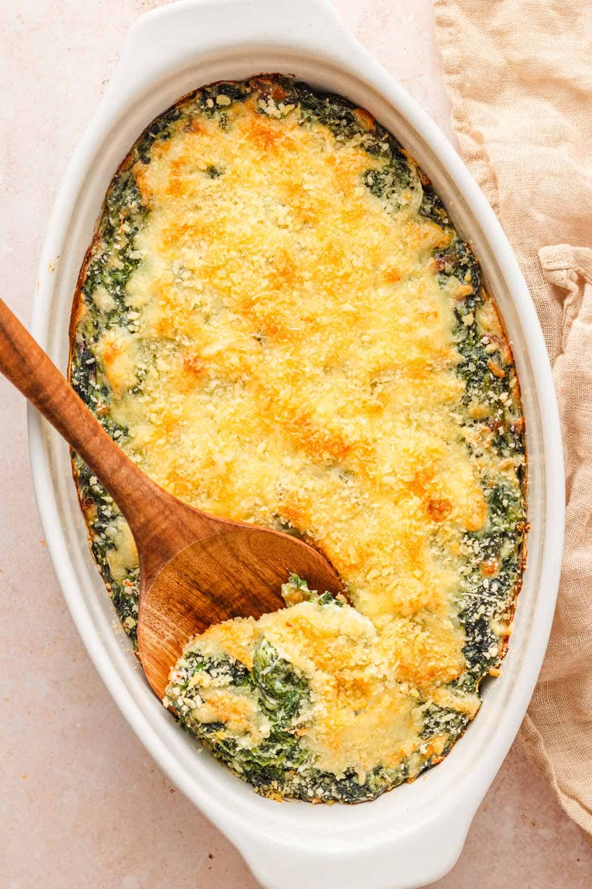 Freshly baked Spinach Gratin with cheesy topping.