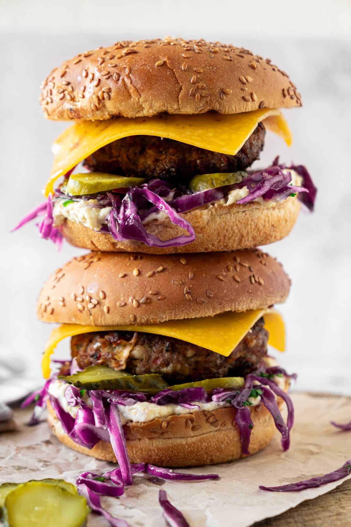 a stack of two stovetop beef burgers with cabbage.