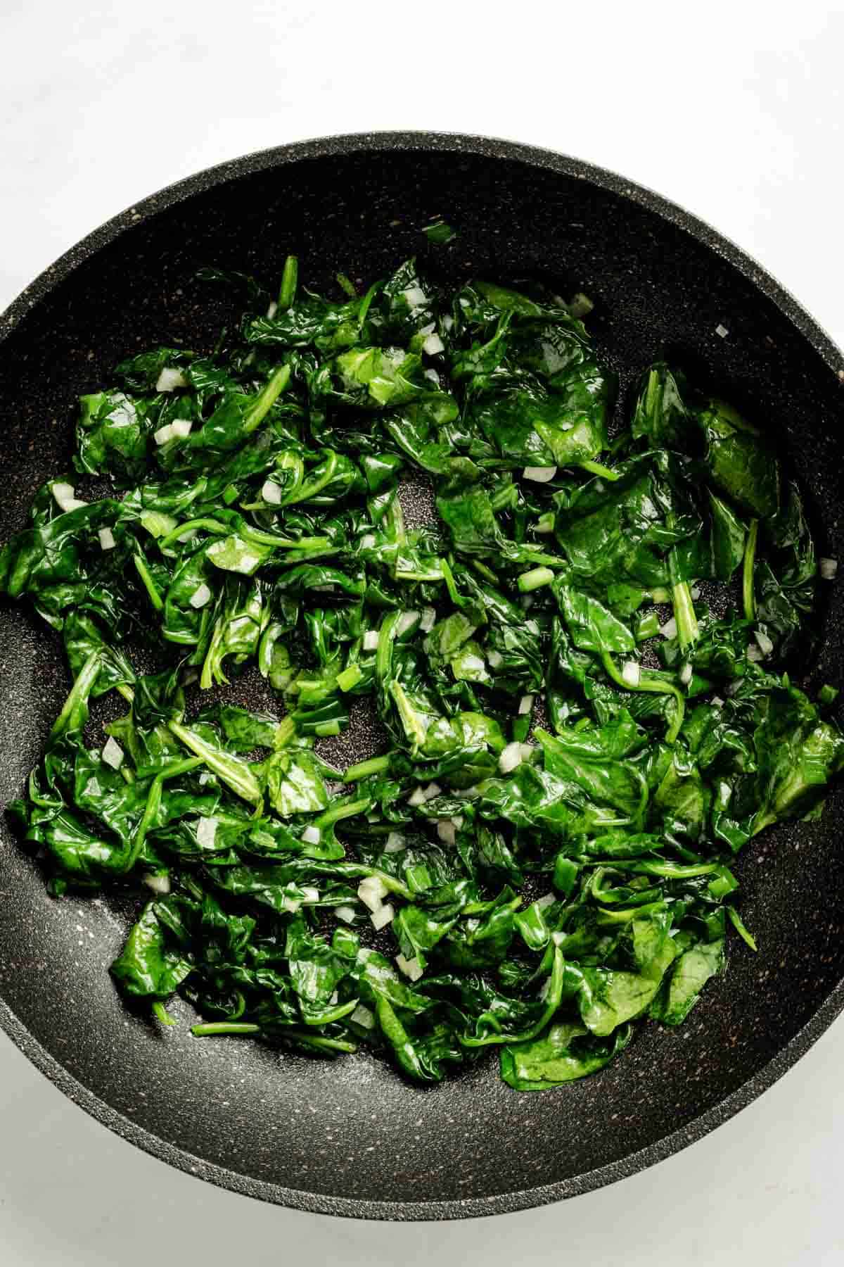 Spinach in skillet.