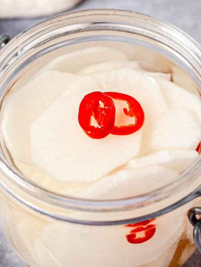pickled daikon radish in a mason jar.