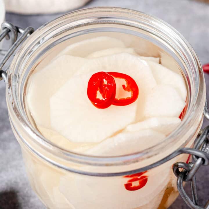 pickled daikon radish in a mason jar.