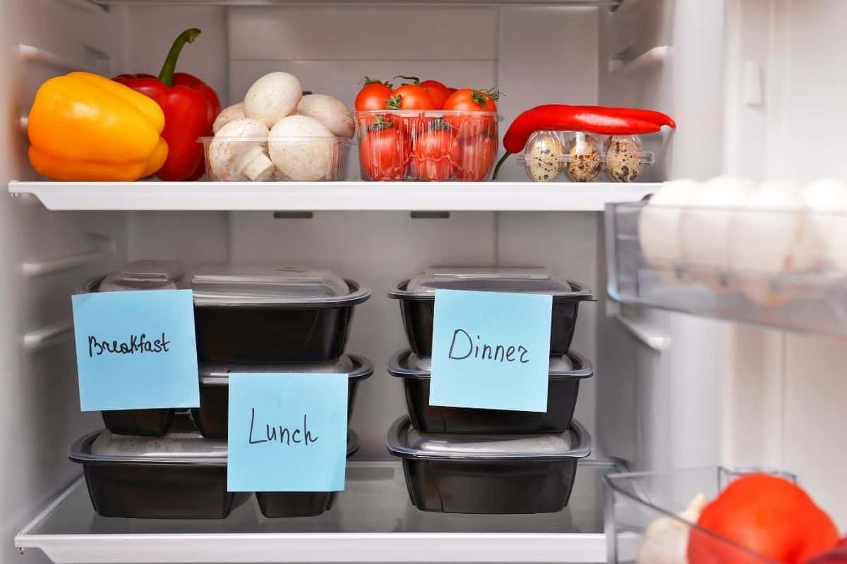 Labelled food containers in the fridge.