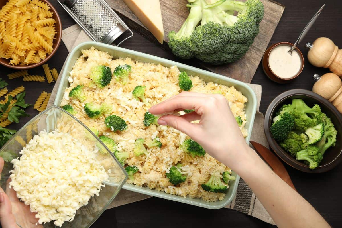 Adding toppings to casserole.