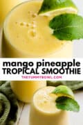 mango pineapple tropical smoothie in a tall glass with mint and lime wedge