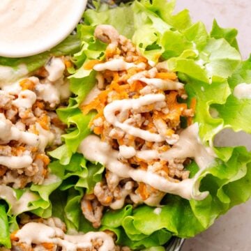 Ground turkey wraps with tahini sauce.