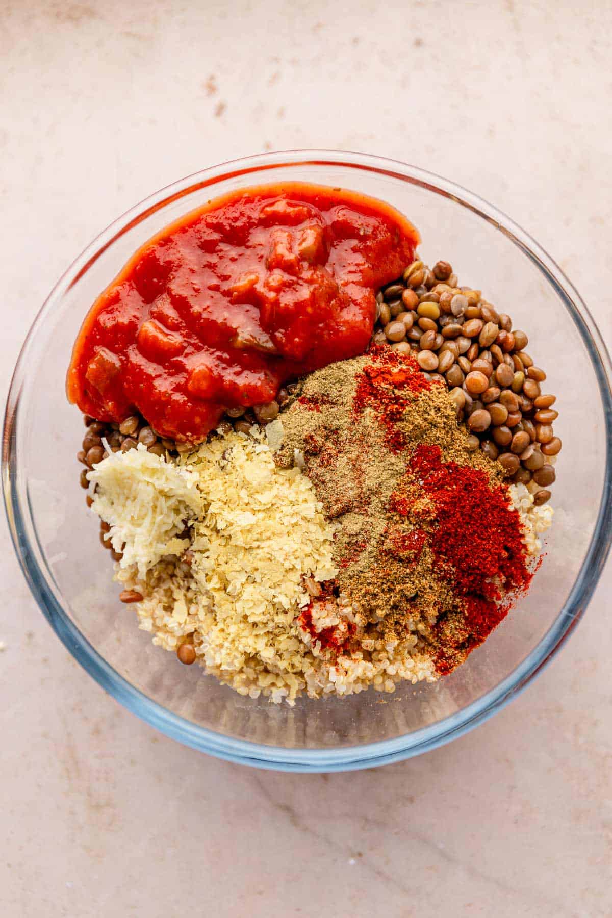 quinoa, lentils and seasoning in a bowl.
