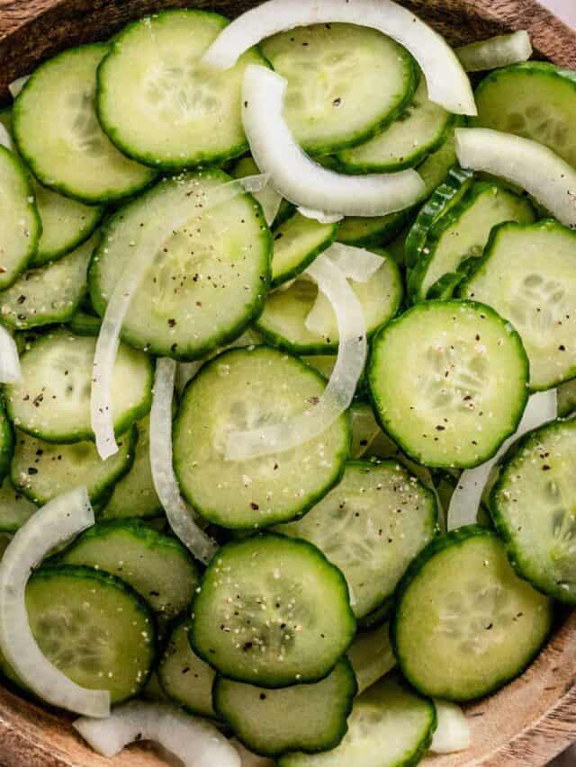 cucumber slices and onions in a bowl.