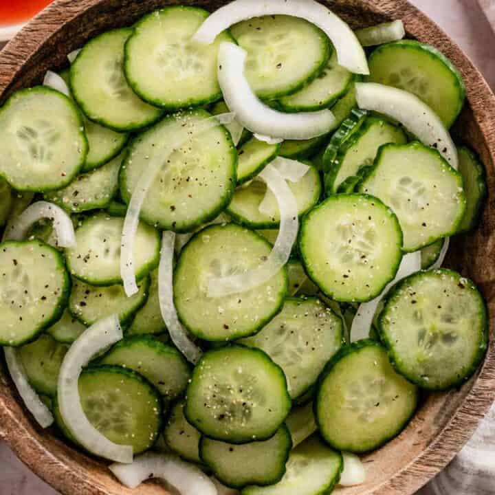 cucumber slices and onions in a bowl.