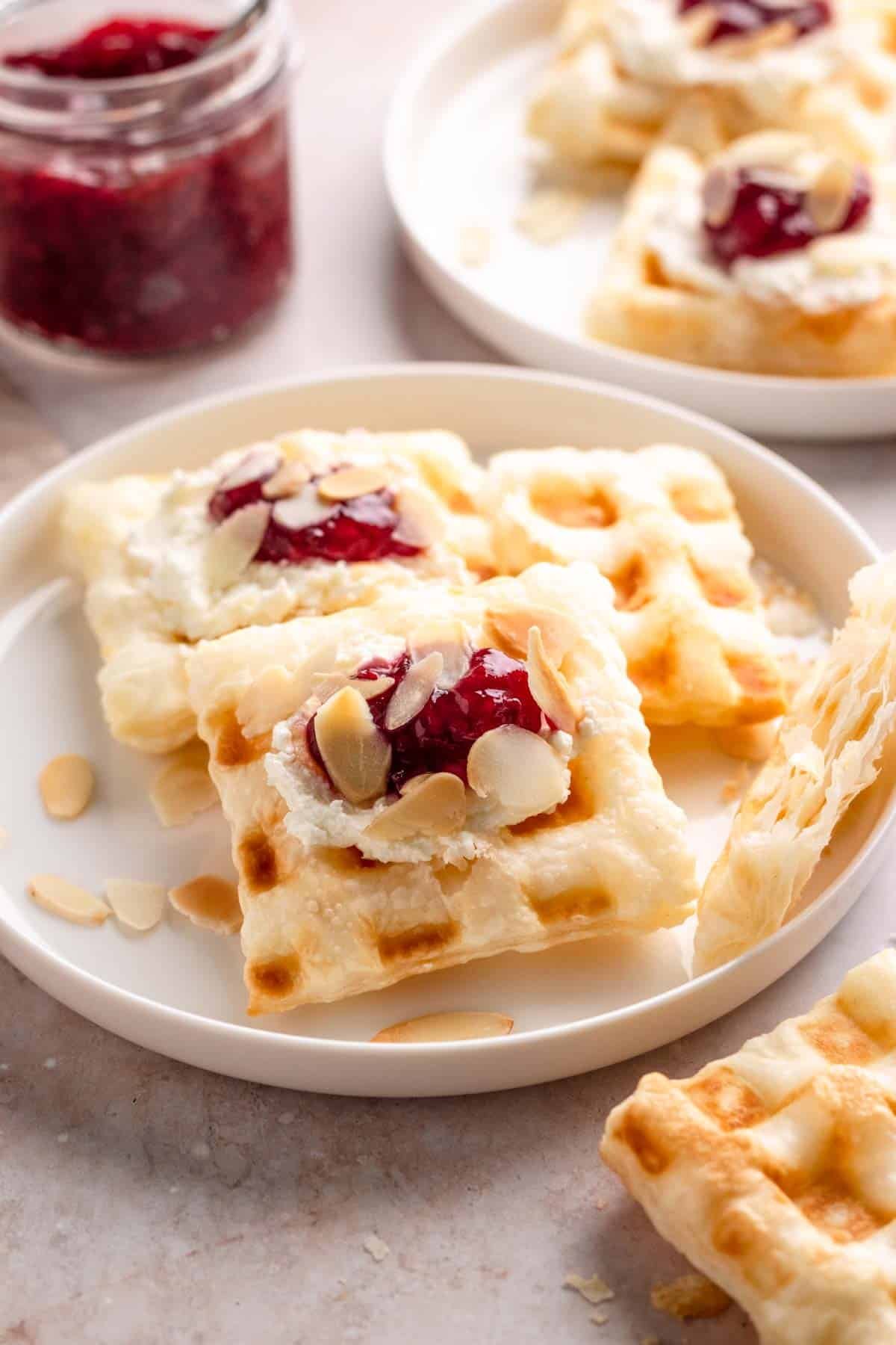 Puff pastry waffles with cream cheese and jam.